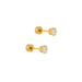 Pair of gold stud earrings with clear gemstones on a white background