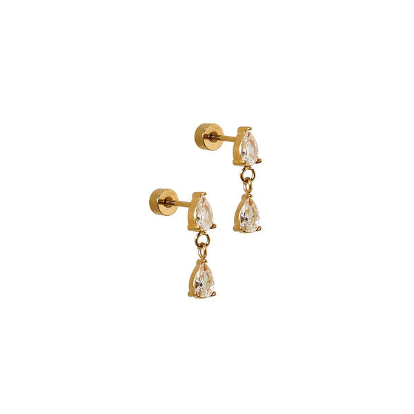 Gold earrings with clear gemstones on a white background
