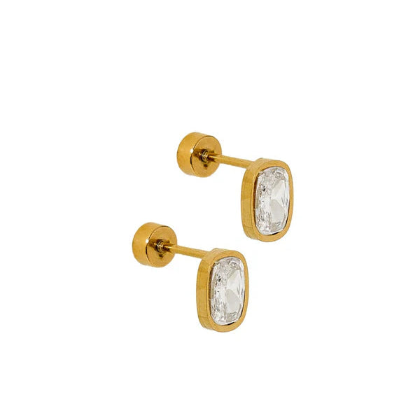 Gold stud earrings with clear gemstones on a white background