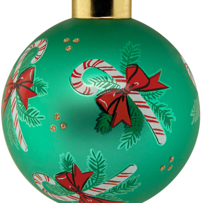 Green Christmas ornament with candy cane and bow design on a white background