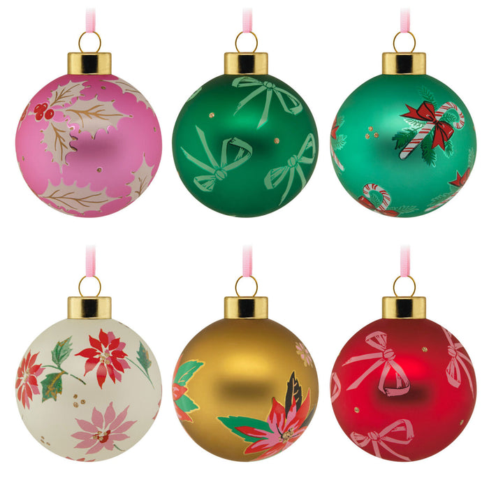 Set of six colorful Christmas ornaments with floral and candy designs on a white background.