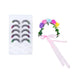 A pair of false eyelashes with a black and white wavy pattern, shown alongside a small rainbow-themed applicator wand on a plain white background.