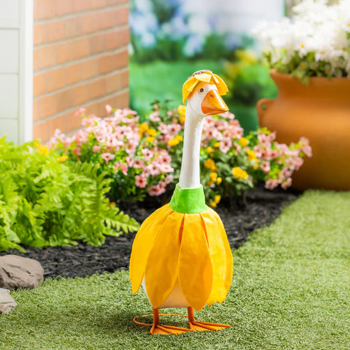 Decorative goose costume with yellow flower petals on a garden background