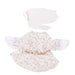 White dress with floral details and matching hat on a white background