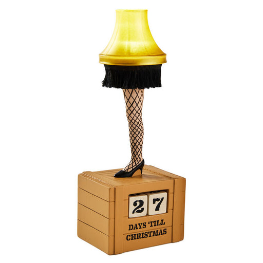 Decorative leg lamp with a calendar showing '27 days till Christmas' on a white background