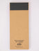 Kraft paper package with black top section on a white background