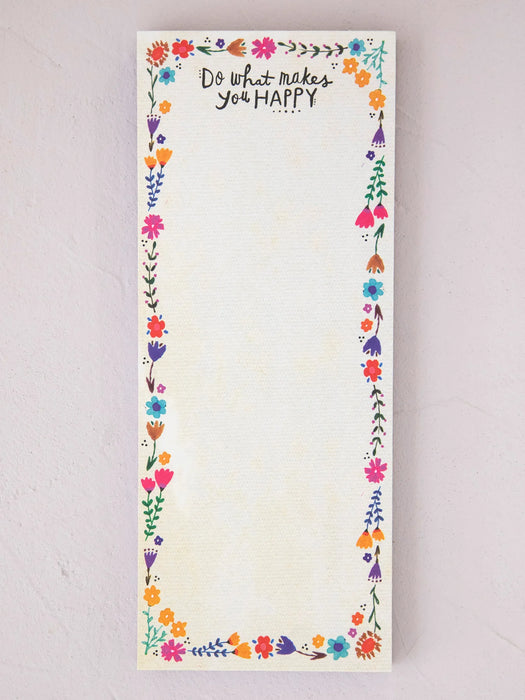 Notepad with floral border and motivational quote on a light background