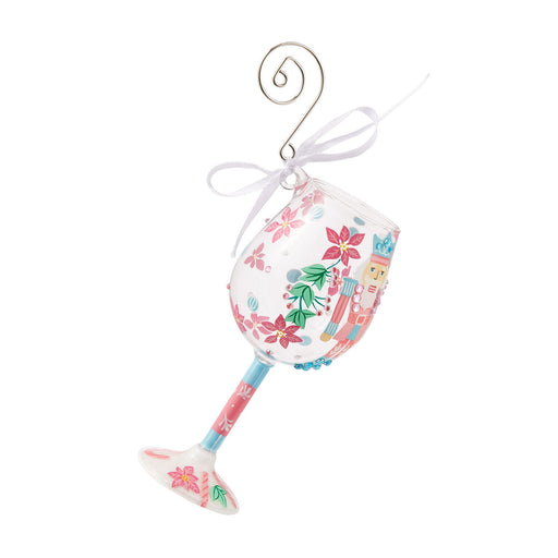 Decorative glass ornament with floral design on a white background