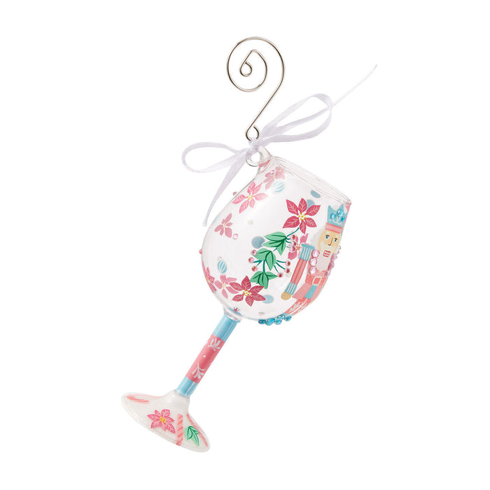 Decorative glass ornament with floral design on a white background