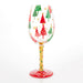 Decorative wine glass with Christmas tree design on a white background