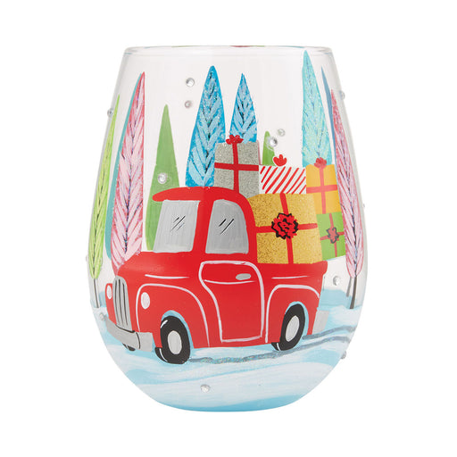 Stemless wine glass with a red truck and Christmas trees design on a white background