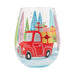 Stemless wine glass with a red truck and Christmas trees design on a white background