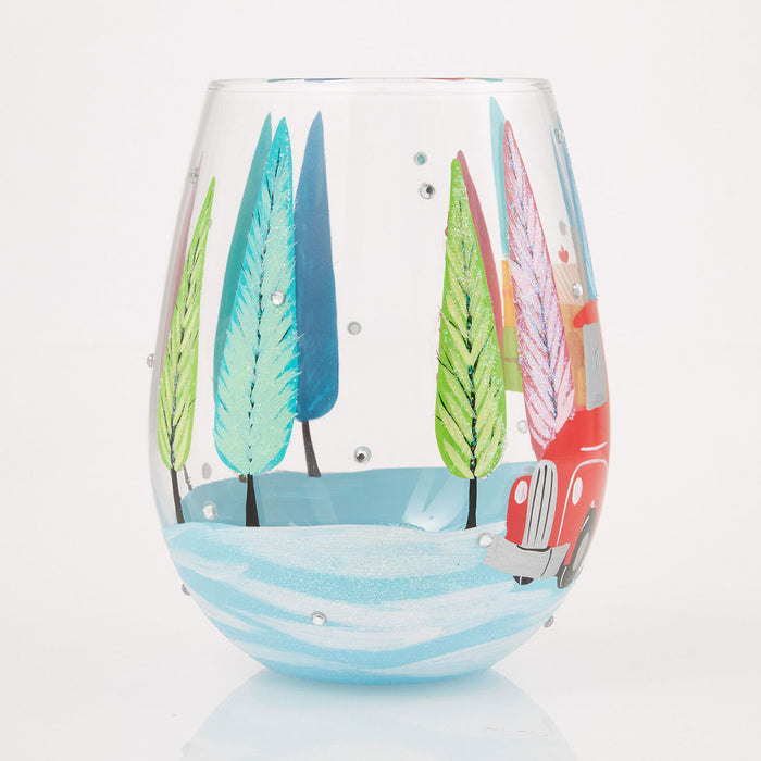 Stemless wine glass with colorful tree and truck design on a white background