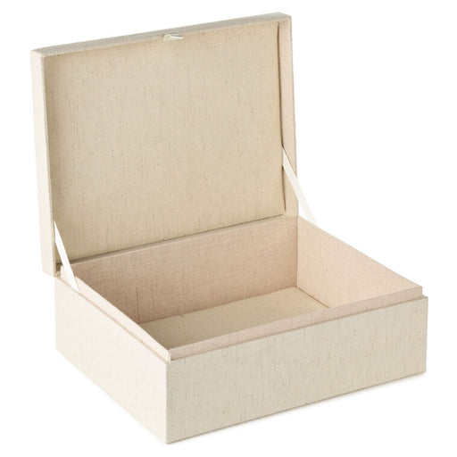 Beige fabric box with a lid on a white background