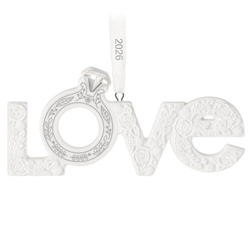Silver 'LOVE' pendant with intricate designs on a white background