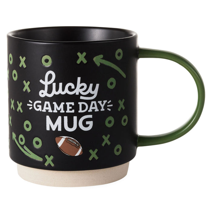 Black mug with 'Lucky Game Day Mug' text and football design on a white background