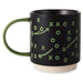 Black mug with green game plan design on a white background