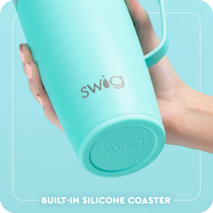 Turquoise Swig tumbler held by a hand with a light blue background