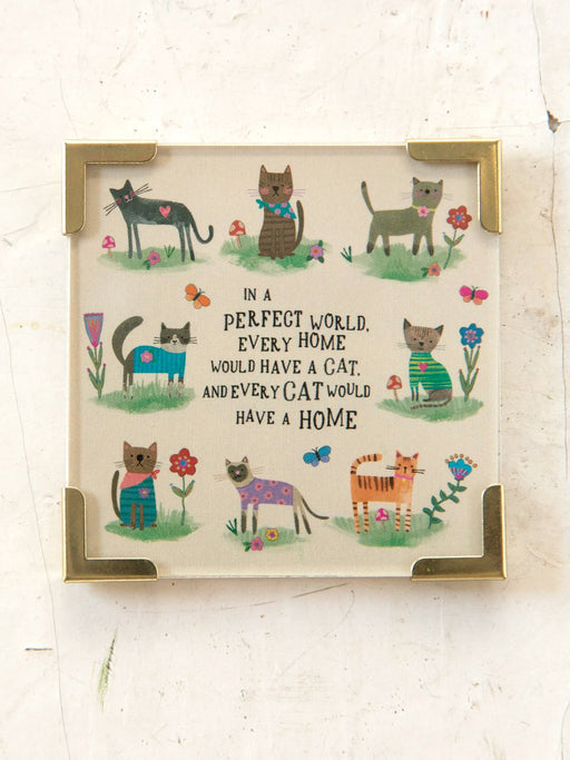 Framed artwork with illustrations of cats and a quote on a white background