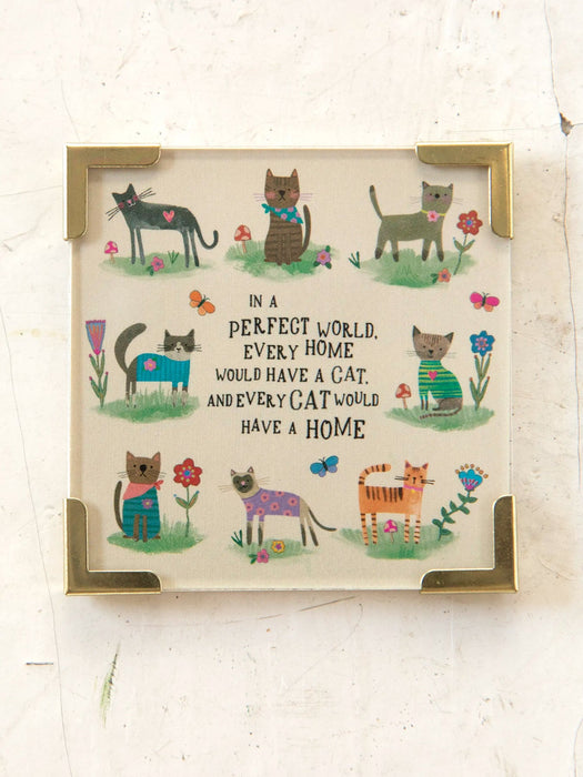 Framed artwork with illustrations of cats and a quote on a white background