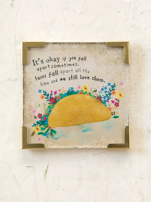 Framed artwork with a taco and floral design on a light background