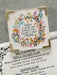 Decorative sign with floral design and motivational quote on a menu background