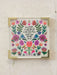 Framed artwork with floral design and motivational quote on a light background