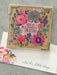 Floral card with colorful flowers and text on a gray background