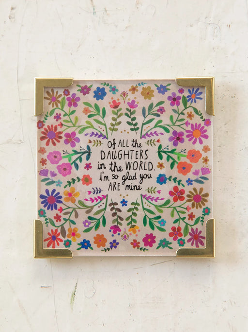 Decorative card with floral design and text on a light background