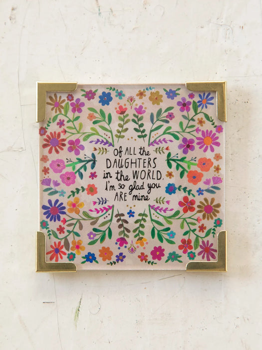 Decorative card with floral design and text on a light background