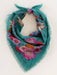 Teal floral scarf on a mannequin with a white background
