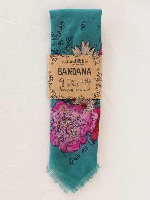 Teal bandana with floral design on a cardboard packaging labeled 'Natural Life'.
