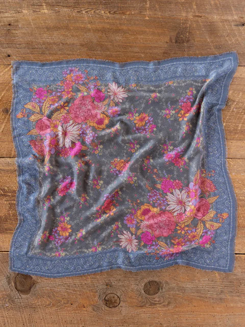 Floral patterned fabric on a wooden surface