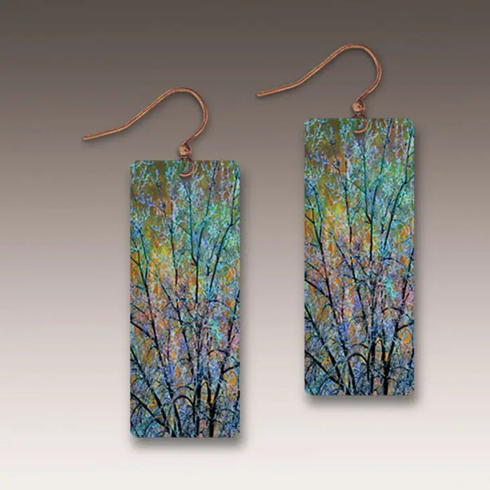 Pair of rectangular earrings with artistic tree design on a neutral background
