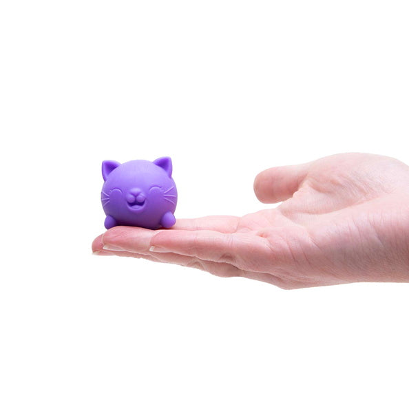 Purple cat-shaped stress reliever held in a hand on a white background