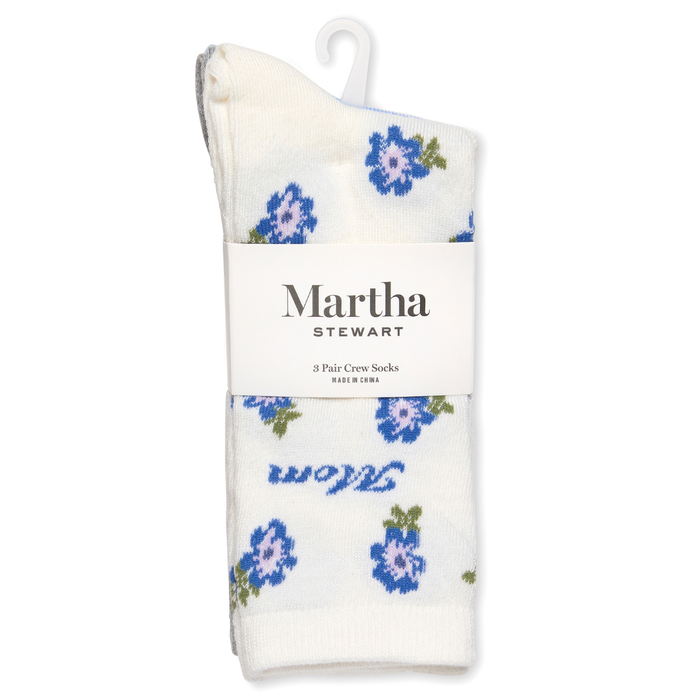Pack of Martha Stewart socks with blue floral pattern on a white background