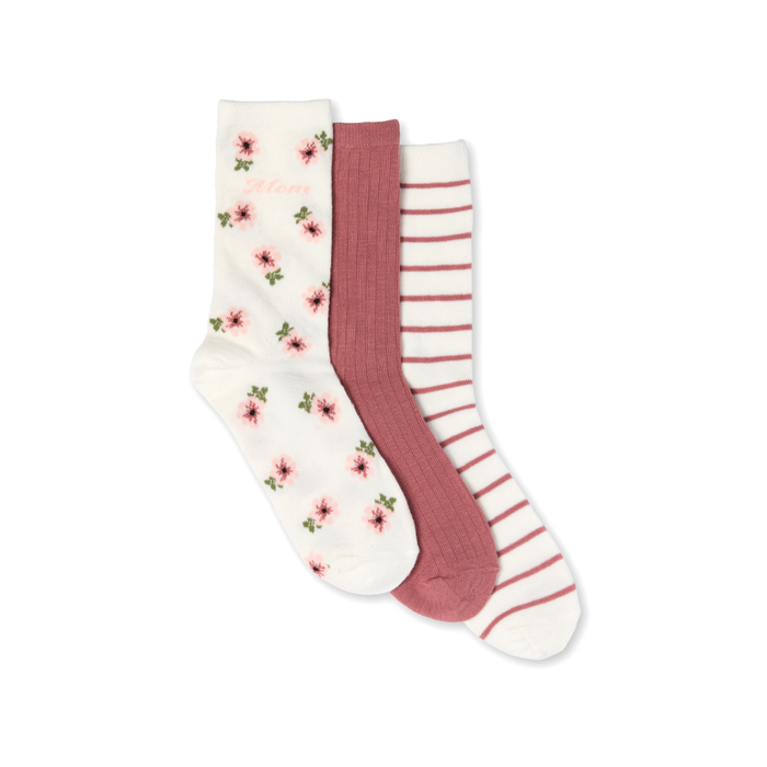 Three pairs of socks with floral and striped patterns on a white background
