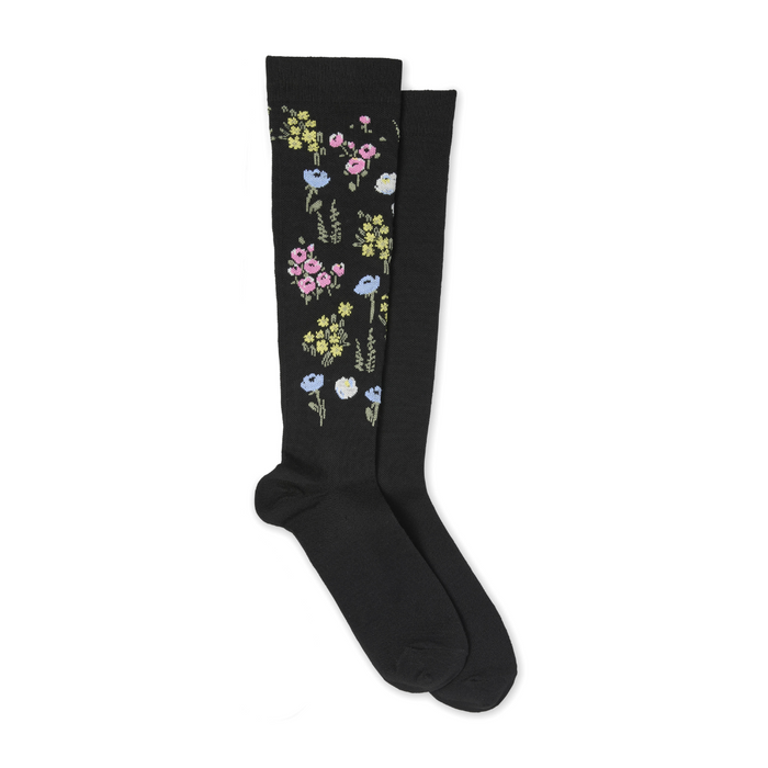 Black knee-high socks with floral design on a white background