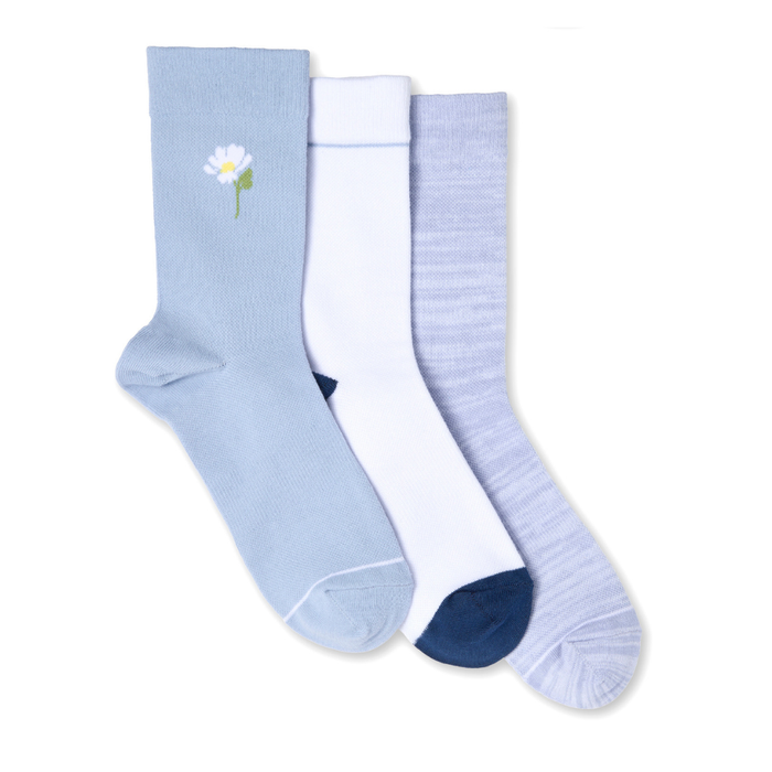 Three pairs of light blue socks with floral design on a white background