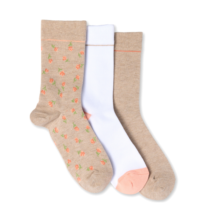 Three pairs of socks in beige, white, and another beige color with floral patterns on a white background.