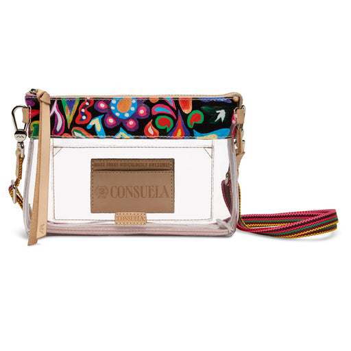 A Consuela clear plastic pouch clutch with a vibrant multicolor paisley patterned top flap, a tan leather logo patch, and a matching multicolor woven wristlet strap, shown on a white background.