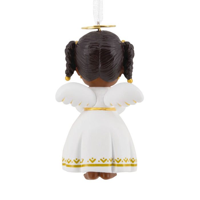A Christmas ornament shaped like a child's head with braided dark brown hair, white wings, and a white dress with gold trim, shown from the back on a plain white background.