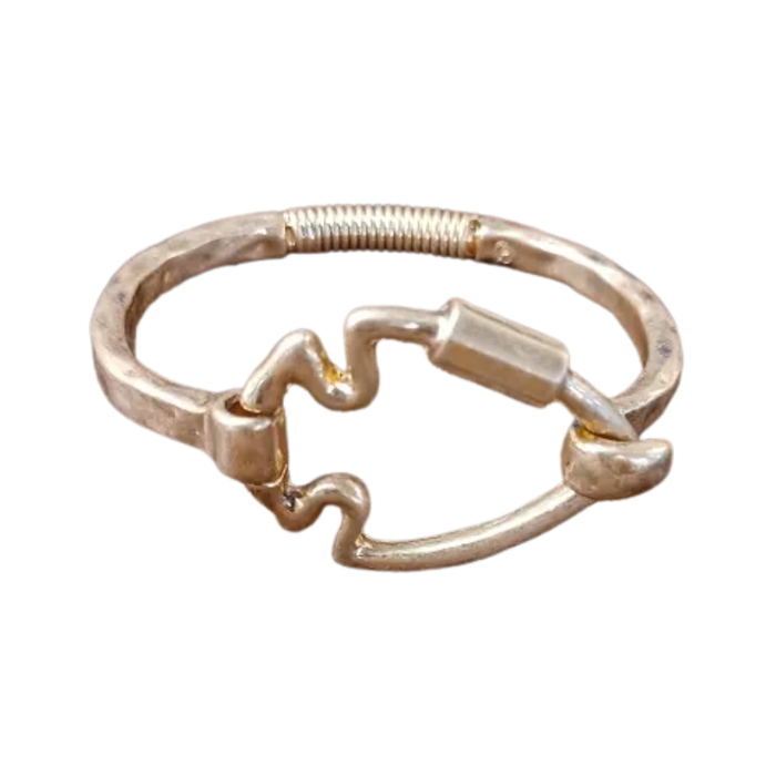 Gold ring with a unique design on a white background