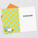 Greeting card with checkered design and humorous text on a light gray background