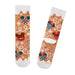 Pair of festive socks with candy cane, lollipop, and reindeer design on a white background