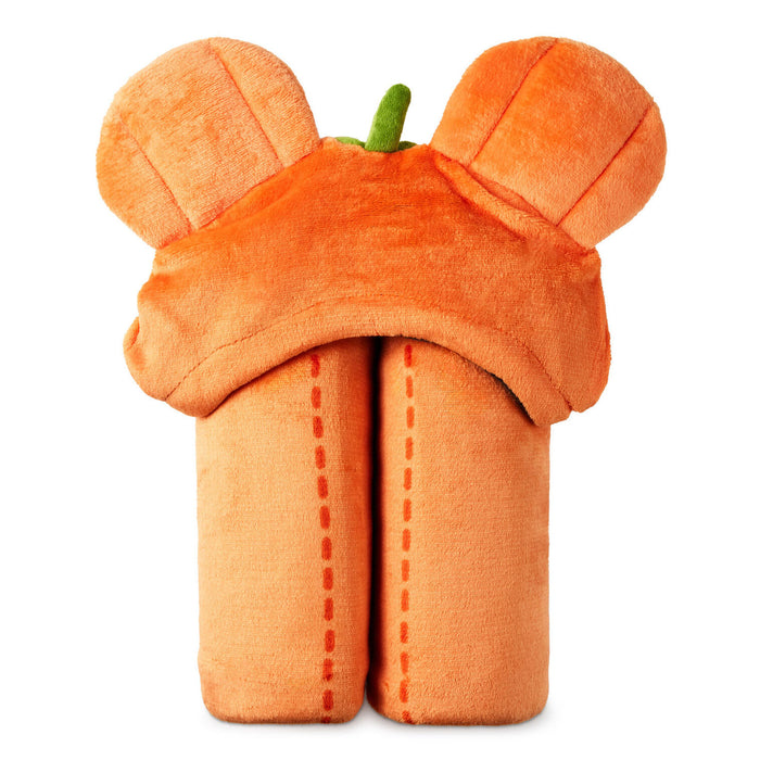 An orange plush blanket with two rounded ears on top and a small green stem detail, photographed on a plain white background.