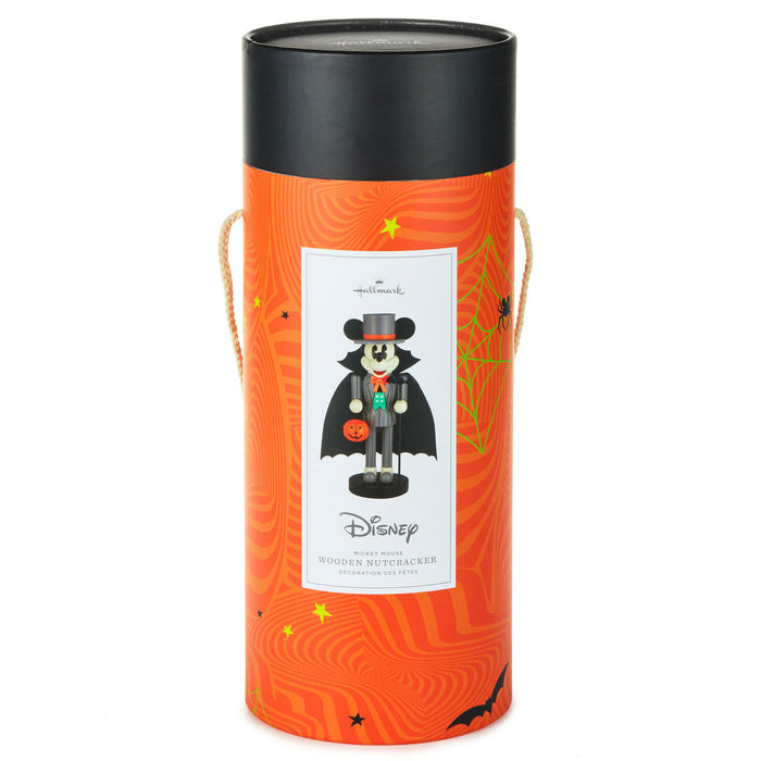 Hallmark Disney Mickey Mouse Halloween wooden nutcracker in an orange cylindrical gift box with a black lid and rope handles, featuring a white front label with Mickey dressed as a vampire.