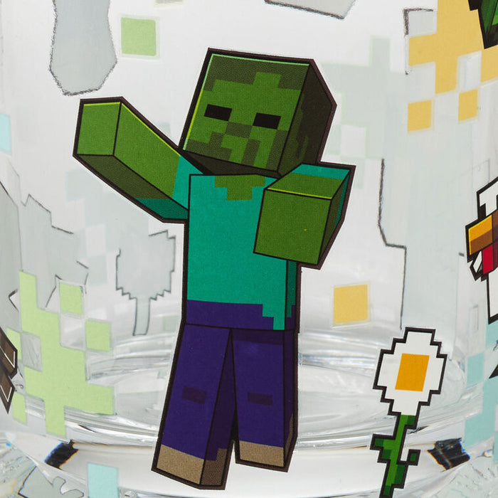 Cartoon character with green skin and blue shirt on a white background