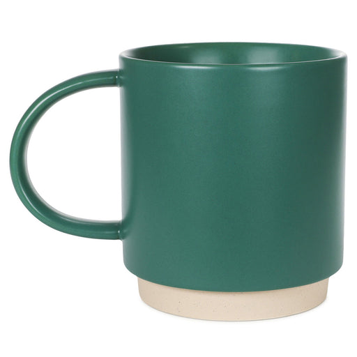 Green mug with a beige base on a white background