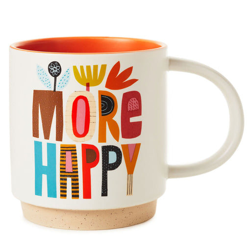 Mug with colorful text 'MORE HAPPY' on a white background